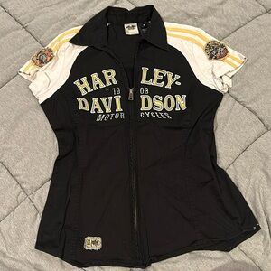 Harley-Davidson. Size M. Black with white sleeves and yellow writing. Zip up.